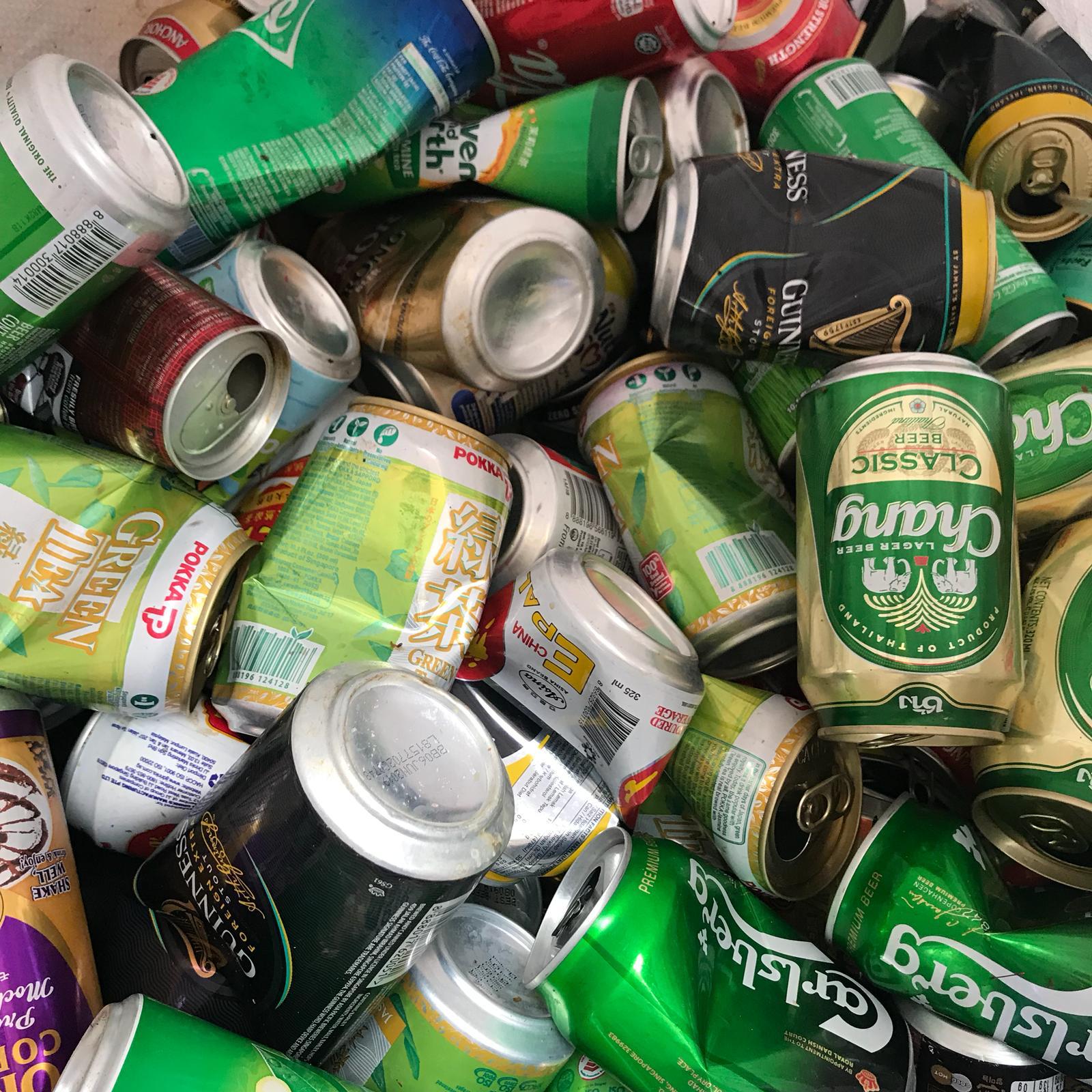 Used aluminium drink cans collected for recycling in Singapore, including beer and soft drink cans.