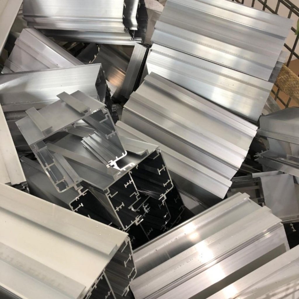 Scrap aluminium extrusion profiles collected for recycling and metal recovery in Singapore.