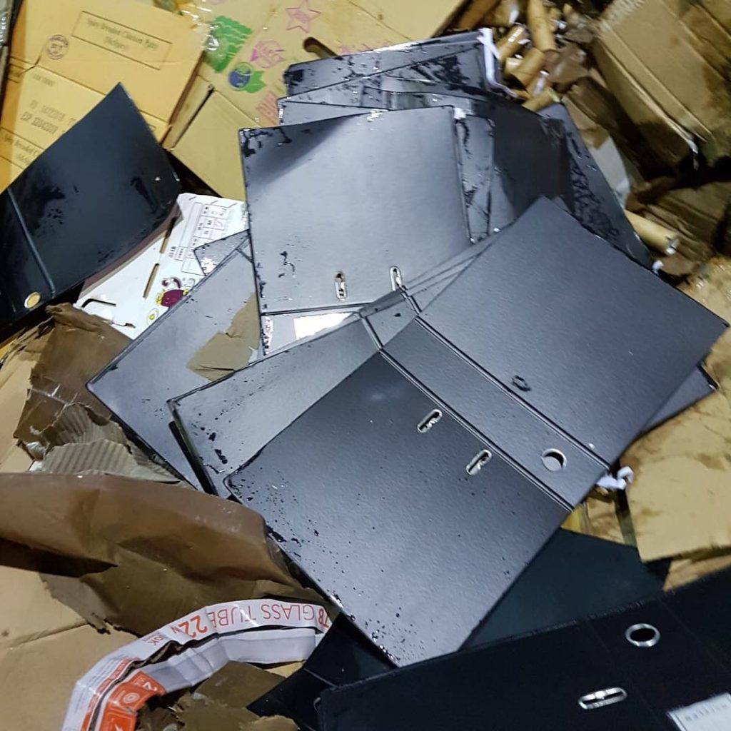 Used arch files and office stationery waste prepared for proper disposal in Singapore.