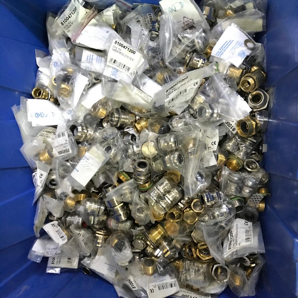 Brass fittings in plastic packaging that must be separated before recycling in Singapore.