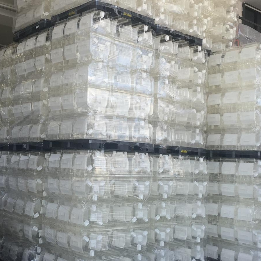 Stacked FOSB and FOUP plastic containers collected for recycling from the semiconductor industry in Singapore.