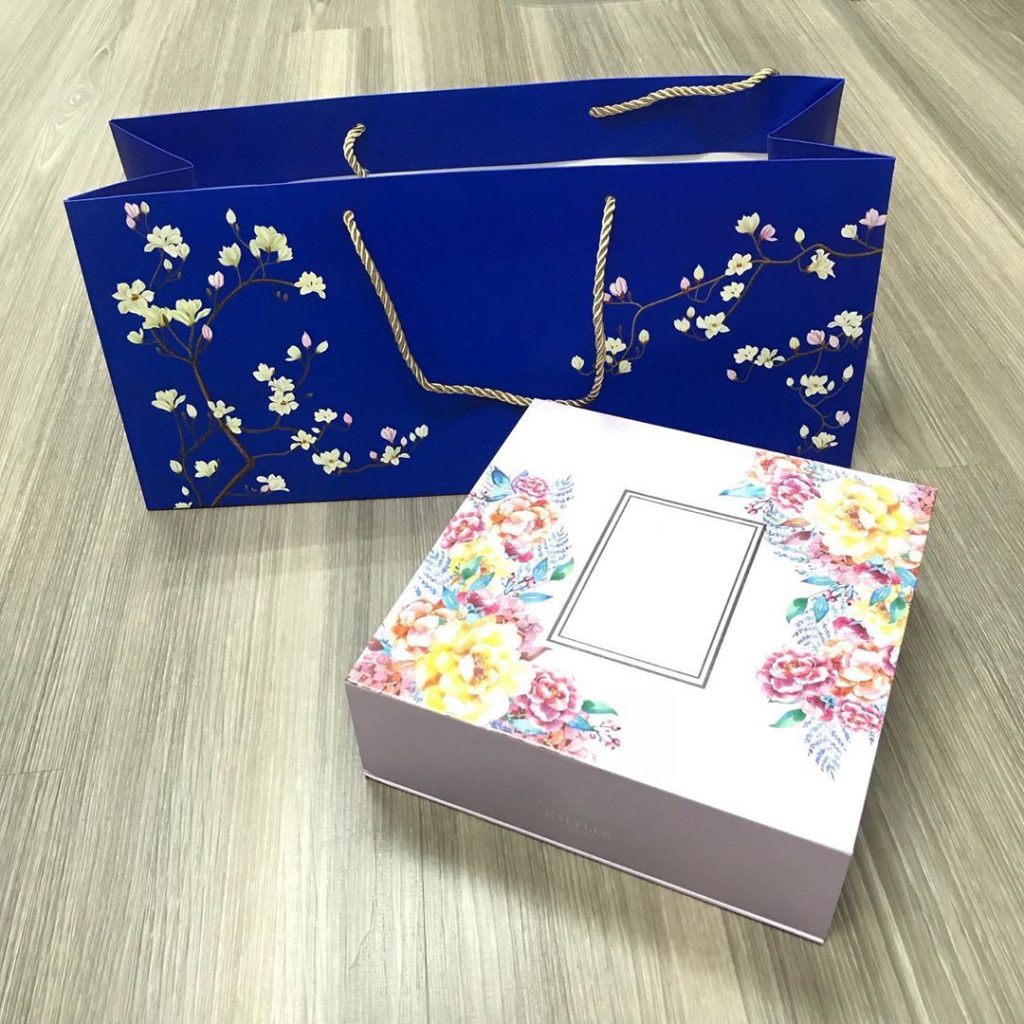 Decorative mooncake box and gift bag collected for recycling or proper disposal in Singapore.