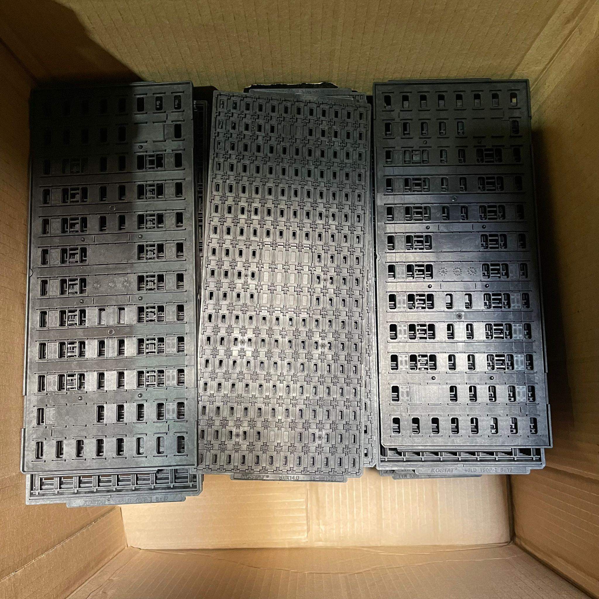 Black IC trays used in semiconductor manufacturing collected for plastic recycling in Singapore.